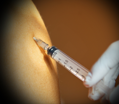 doctor inecting on deltoid muscle