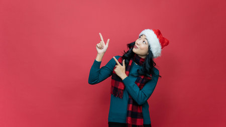 Portrait photo positive lady in santa claus hat point index finger, copyspace direct way x-mas...