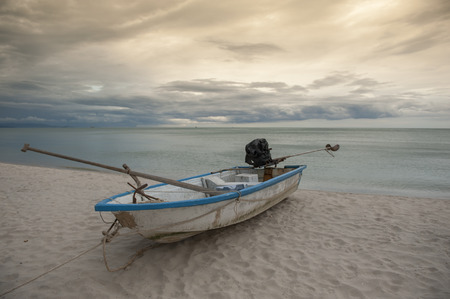 Boat in the tropical sea under gloomy dramatic sky. Thailandの写真素材