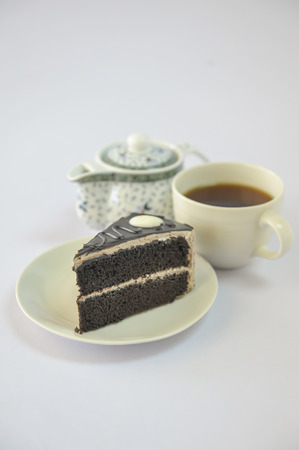 the chocolate cake and cup of teaの写真素材