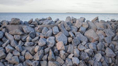 Stone embankment to prevent the waves of the sea.の写真素材