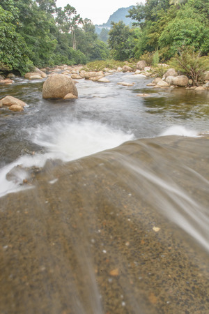 Un-focus image of Brook and rocks in the mountains at Kiriwong village, Nakorn Sri Thammarat., Thailand.の写真素材