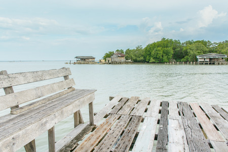 Wood terrace and Beach and tropical sea with blue sky