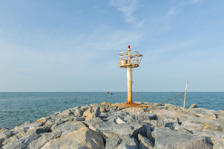 Rock dam and sea with blue skyの写真素材