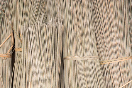 Bulrushes (Lepironia Articulata) are bundled and left to dry under the sun before using as a...