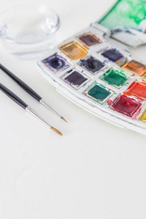 Paints and childish painting equipment, Watercolors and brushes, Colorful water paint, water color paints(selective focus)の写真素材