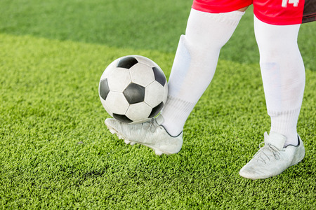 Kid soccer juggling football for training.の写真素材