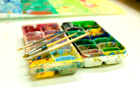Art palette with blobs of paint. There are equipment for make art.の写真素材