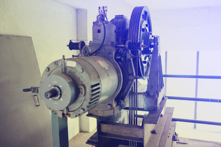 Motor driven with sling cable and wheel in control room of passenger lift system.の写真素材