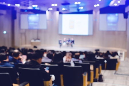 Blurry of auditorium for shareholders' meeting or seminar event.