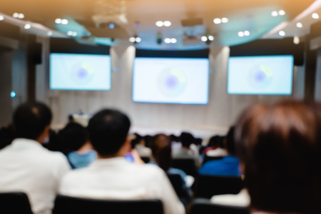Blurry of auditorium for shareholders' meeting or seminar event.
