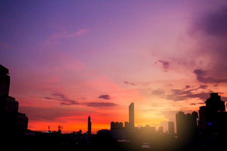 Sky with clouds over the evening city with sunset.