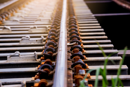 Railway track on steel bridge with selective focus. Train transportation.の写真素材