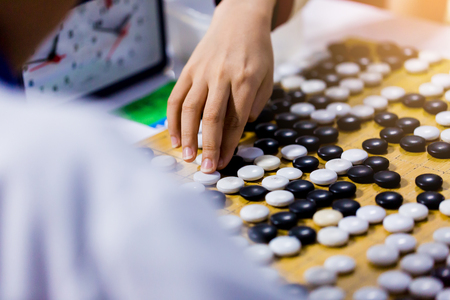 Chinese go games with countdown clock for fighting. The concept of competition with time limit or pressure or meditation.の素材 [FY310112916928]