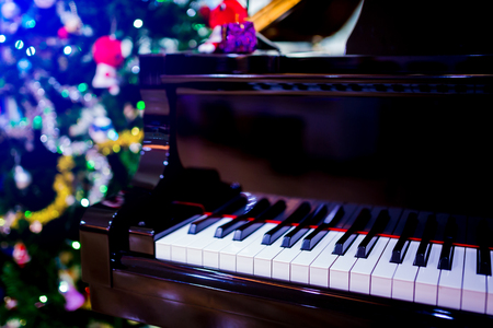 Piano and Christmas tree for christmas holiday background. New Year holidays background.の写真素材