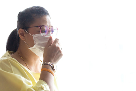 Woman wearing face mask with white isolated because of air pollution