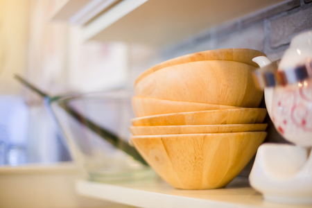 wooden bowl on Shelves in restaurantの写真素材
