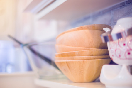 wooden bowl on Shelves in restaurantの写真素材