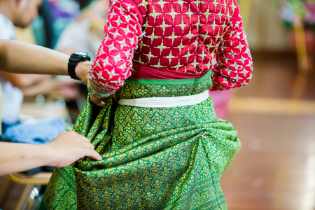 The process of dressing the Thai pantomime for the actors with hand sewing, repairing, the khon traditional Thai ,pantomime seriesの写真素材
