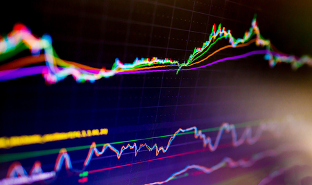 Selective focus of Business graph charts of financial instruments with various type of indicators combine with gold and account book and money. Concept investment. Moving average graphの写真素材