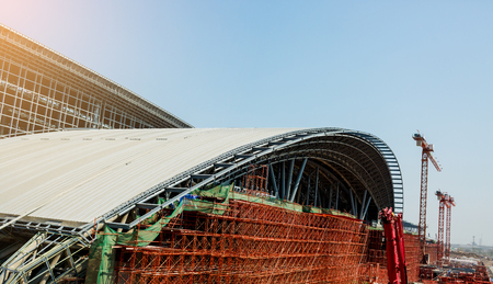 Under construction of metal steel framework outdoors buildings with crane, metal steel framework of bridge construction, the concept of under construction.の写真素材