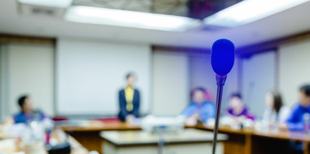 Soft focus of desktop wireless Conference microphones with blurry business group in a meeting room, microphone on the desk in meeting room with blur people background. the concept of speaking.の写真素材