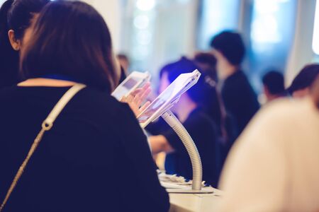 tablet at register counter for registration in to seminar or meeting with blurry people background. selective focus. the concept of electronic registration.の写真素材