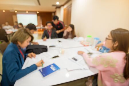 blurry image. startup business team brainstorming on meeting workshop. team working on project together and sharing ideas in workshop. group of multi ethnic corporate people having a business meeting.の写真素材