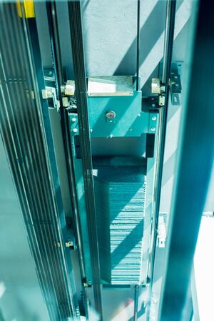 Blurred images see from inside the lift are moving. Structure and equipment within the new passenger lift. Looking through the glass.の写真素材