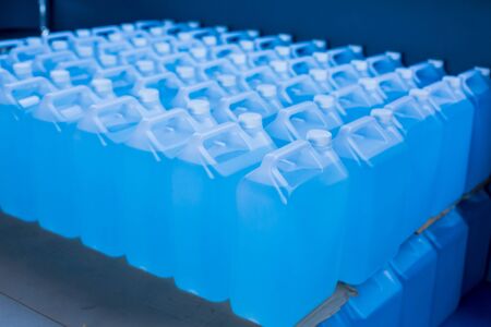 Alcohol for cleaning and sanitizing is contained in gallons in the warehouse. Many gallon alcohol gel for sanitizing Coronavirus Covid-19. Products for sale to anti Coronavirus protection (Covid 19).の写真素材
