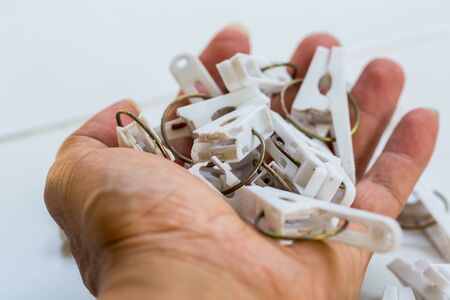 Many old plastic clip broken in hand are recyclable waste. Recycle waste from home management...