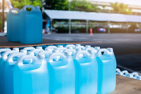 Alcohol for cleaning and sanitizing is contained in gallons in the warehouse.