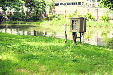 Electric control box in the park. Water pump booster and lighting panel for checking system in the...
