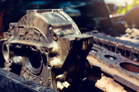Selective focus to old part of engine. Pile of rusty and dirty obsoleted old vehicle metal engine...