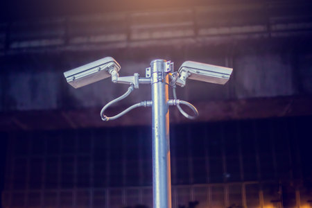 Selective focus to CCTV Camera with blurry building.
