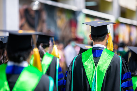 Selective focus to many graduates line up for the graduation ceremony in Bangkok Thailand.の写真素材