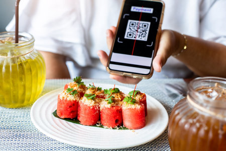 Selective focus to Thai food that uses watermelon as the main ingredient with blurry QR code tag on...