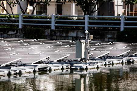 Selective focus to solar power station. Solar photovoltaic power station on water. Solar panels or...