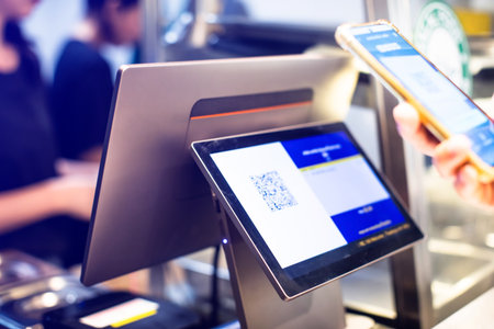 Selective focus to POS Machine with blurry customer scan QR code to payment and receipt at cash...