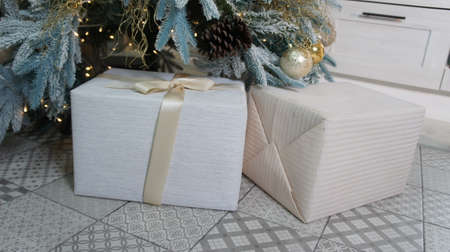 New Years gifts under the tree. Merry Christmasの写真素材