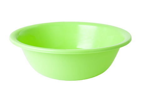 green plastic wash bowl isolated on whiteの写真素材