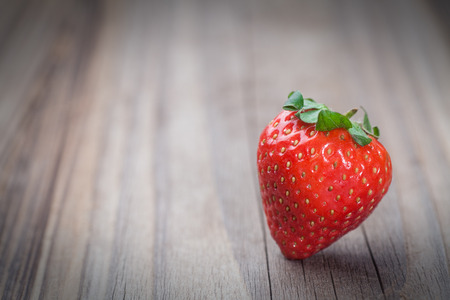 fresh strawberry on old woodの写真素材