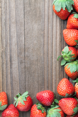 strawberries on old woodの写真素材