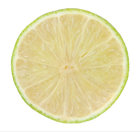 half of lime citrus fruit isolated on white backgroundの写真素材