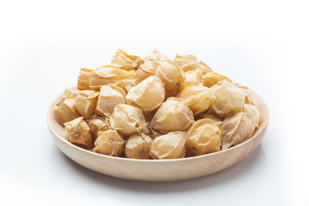 Physalis fruit in a wooden plateの写真素材