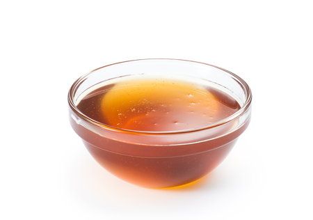 Fresh honey in a glass bowlの写真素材
