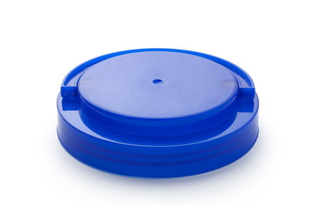 Blue plastic lid of jar isolated on white background.の写真素材