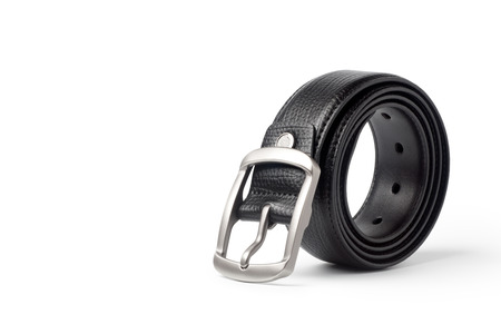 Rolled-up black leather belt isolated on white backgroundの写真素材