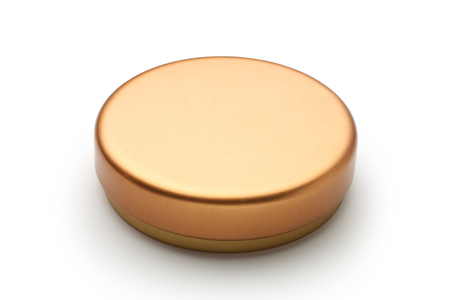 Golden metal lid of tube isolated on white background.の写真素材