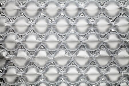 inflatable air buffer plastic bag texture background. protective packages.の写真素材